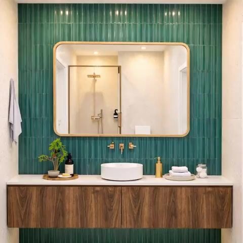 Modern bathroom walkthrough with green kitkat wall tiles and walnut wood laminate floating vanity