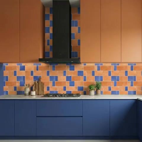 Modern kitchen walkthrough with terracotta and blue laminate, geometric blue and terracotta backsplash tiles