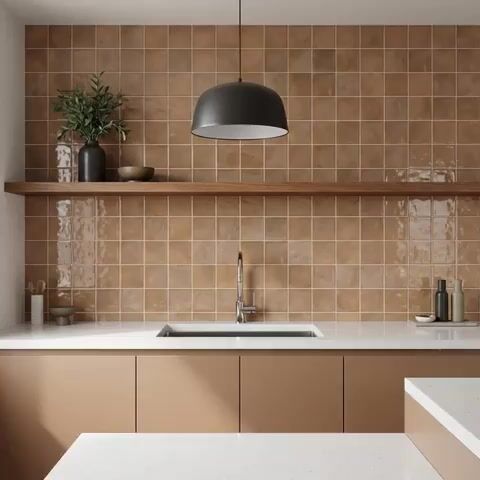 Minimalist kitchen walkthrough with matte beige laminate cabinets, white quartz countertop, and warm beige square wall tiles