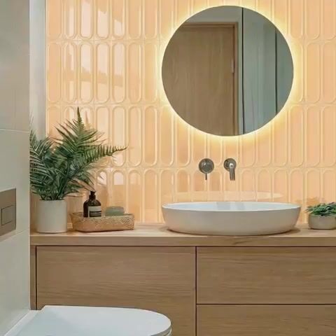 Scandinavian bathroom walkthrough with peach kitkat wall tiles and light oak wood vanity