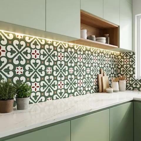Modern kitchen walkthrough with sage green laminate cabinets, moroccan patterned backsplash tile, and white marble countertop