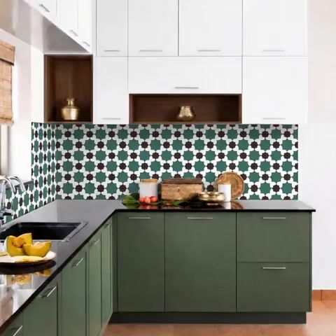 Modern kitchen walkthrough with olive green laminate, white laminate, and geometric moroccan backsplash tiles