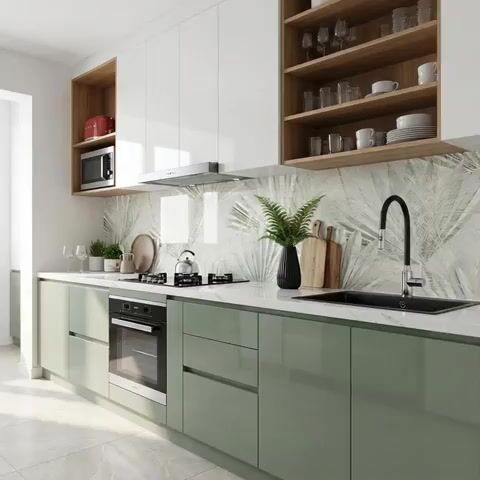 Modern kitchen with sage green laminate, white quartz countertop, and tropical wallpaper backsplash