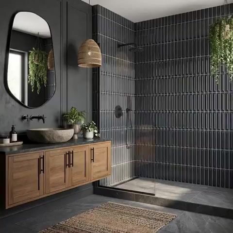 Modern bathroom walkthrough with charcoal kitkat wall tiles, black stone countertop, and natural wood vanity