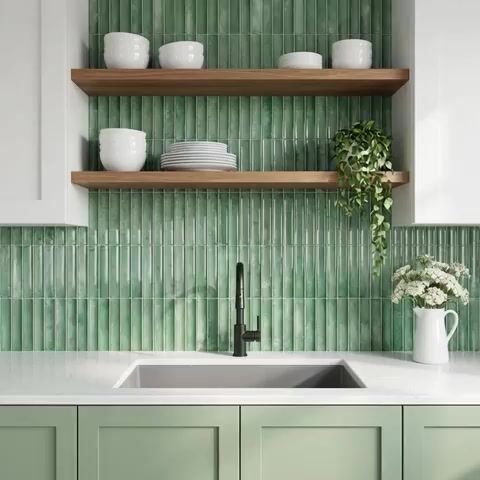 Modern kitchen walkthrough with sage green kitkat wall tiles, white quartz countertop, and pastel green laminate cabinets