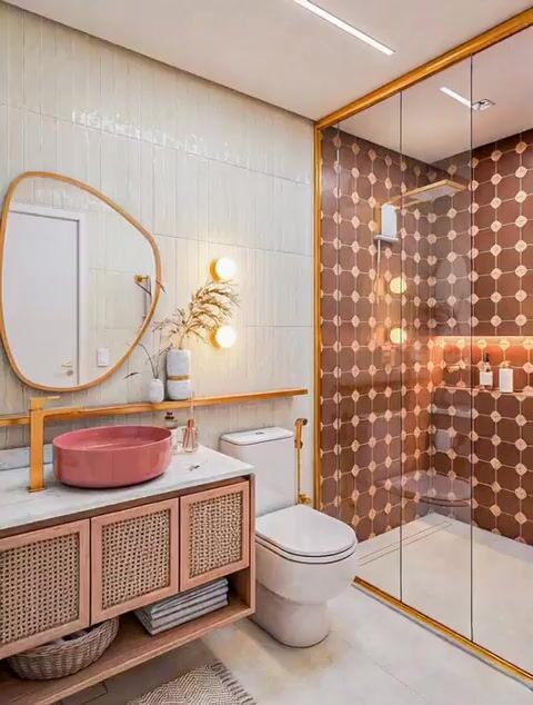 Modern bathroom with beige vertical subway wall tiles, terracotta geometric shower tiles, and rattan vanity in 3 BHK apartment Brigade Northridge Yelahanka Bengaluru