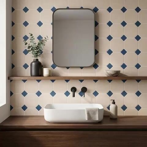 Modern bathroom walkthrough with beige and blue geometric wall tiles and walnut wood vanity