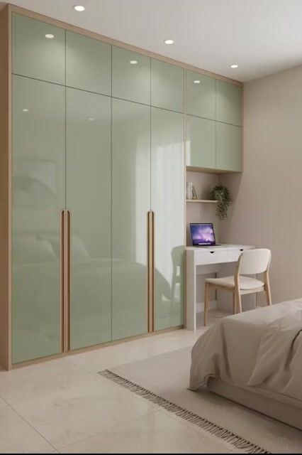 Minimalist bedroom with sage green high gloss laminate wardrobe and beige marble floor tiles in Bengaluru