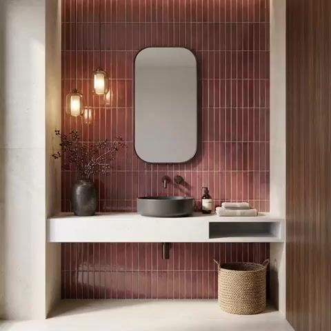 Modern bathroom with burgundy kitkat wall tiles and white quartz floating vanity