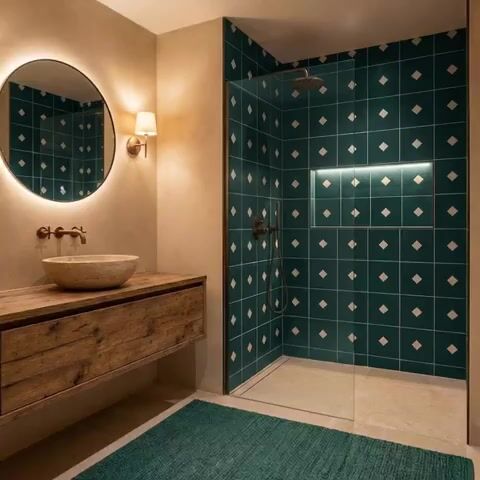Modern bathroom walkthrough with teal geometric wall tiles and rustic wood vanity
