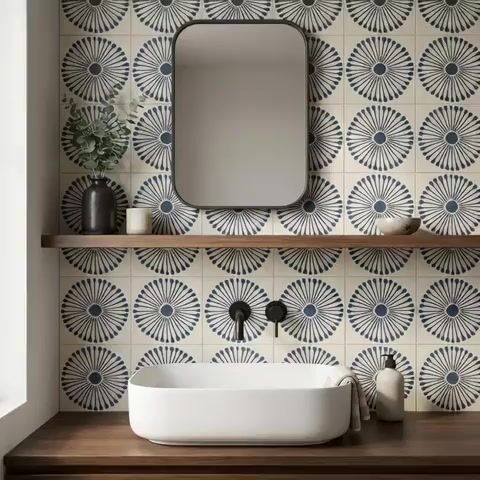 Modern bathroom walkthrough with blue geometric patterned wall tiles and walnut wood vanity