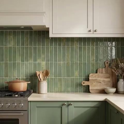 Modern kitchen walkthrough with sage green kitkat backsplash tile and cream quartz countertop