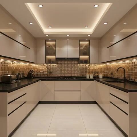 Modern U-shaped kitchen with beige high gloss laminate, black quartz countertop, and gold mosaic backsplash tiles in Bengaluru