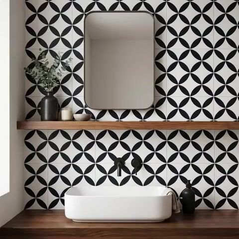 Modern bathroom walkthrough with black-and-white geometric wall tiles and walnut wood countertop
