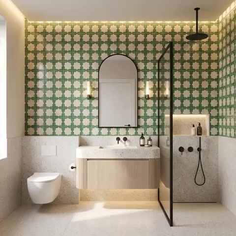 Modern bathroom with green geometric wall tiles and terrazzo floor and wall tiles