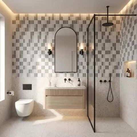 Scandinavian bathroom walkthrough with terrazzo floor tiles, fluted wood vanity, and geometric grey wall tiles