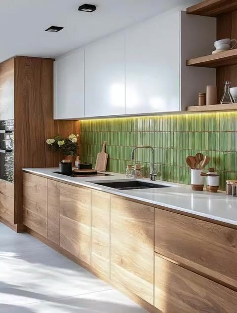 Scandinavian kitchen with oak wood laminate, white laminate cabinets, and green kitkat backsplash tiles