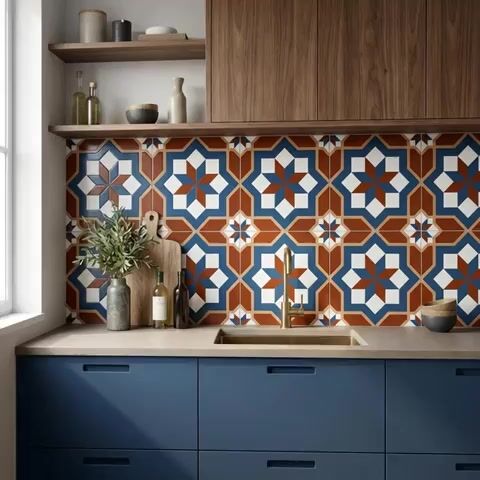 Mediterranean kitchen walkthrough with blue laminate cabinets, walnut wood, and terracotta geometric patterned backsplash tiles