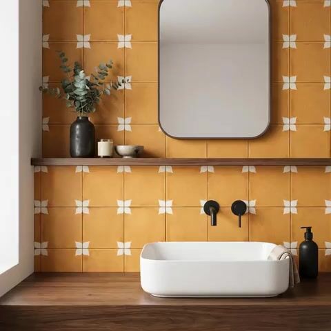 Modern bathroom walkthrough with mustard patterned wall tiles and walnut wood countertop