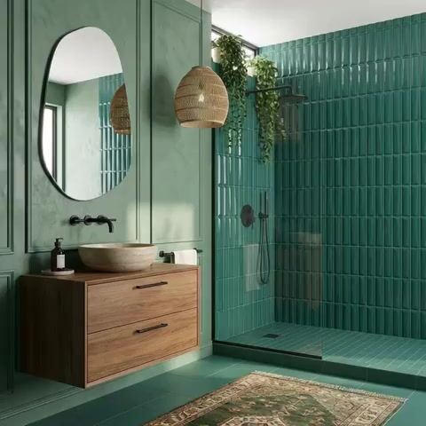 Modern bathroom walkthrough with green kitkat wall tiles, matte green floor tiles, and walnut wood floating vanity