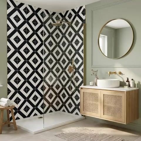 Modern bathroom walkthrough with black-and-white geometric wall tiles and cane-front floating vanity