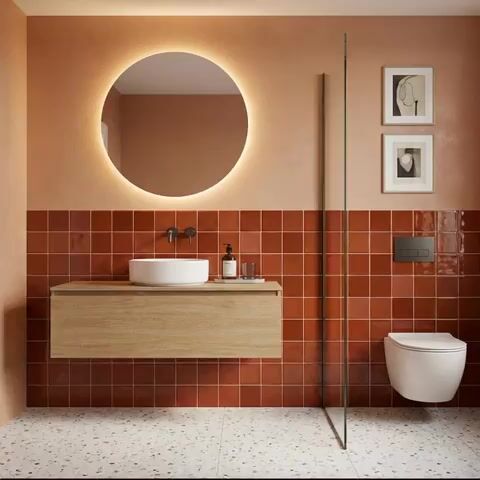 Modern bathroom walkthrough with terracotta wall tiles, terrazzo floor tiles, and light oak floating vanity