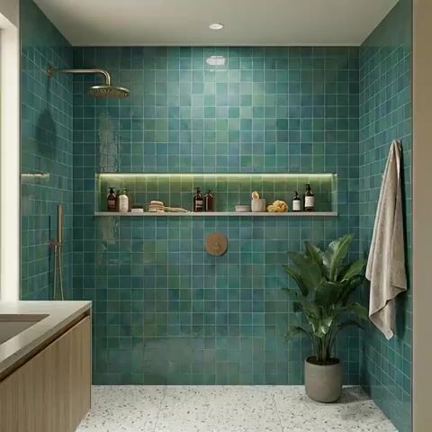 Modern bathroom walkthrough with teal green square wall tiles and terrazzo floor tiles