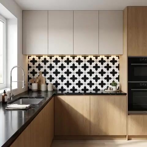 Modern kitchen walkthrough with oak wood laminate, black marble countertop, and geometric black-and-white backsplash tile
