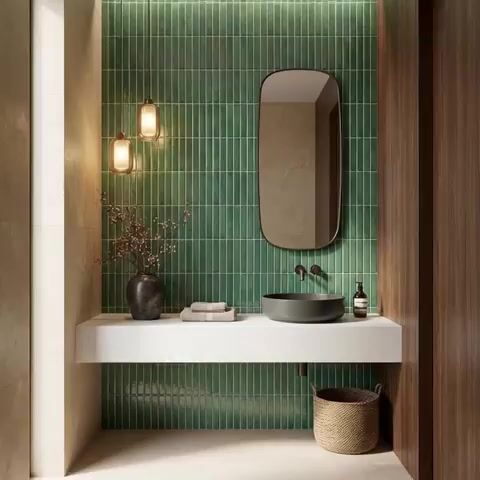 Modern bathroom walkthrough with green kitkat wall tiles, white quartz countertop, and wood laminate accent