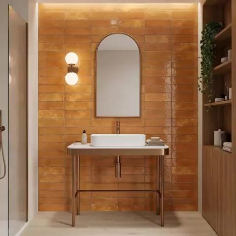 Modern bathroom walkthrough with terracotta subway wall tiles and light wood laminate shelving