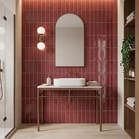 Modern bathroom walkthrough with glossy terracotta vertical subway wall tiles and light wood floor tile