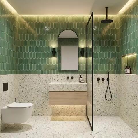 Modern bathroom walkthrough with green scallop wall tiles and terrazzo floor and wall tiles