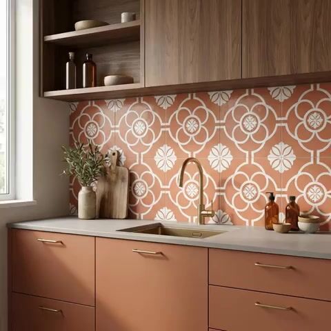 Modern kitchen walkthrough with terracotta patterned backsplash tile, matte peach laminate cabinets, and walnut wood overheads