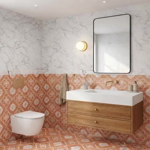Modern bathroom walkthrough with marble wall tiles, terracotta floral patterned tiles, and wood vanity