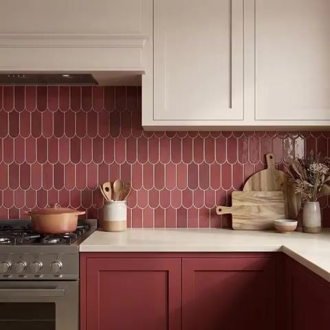 Modern kitchen walkthrough with blush pink and terracotta laminate, cream quartz countertop, and scallop pink backsplash tile