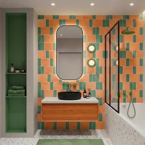 Modern bathroom walkthrough with green and terracotta subway wall tiles, terrazzo floor, and wooden vanity