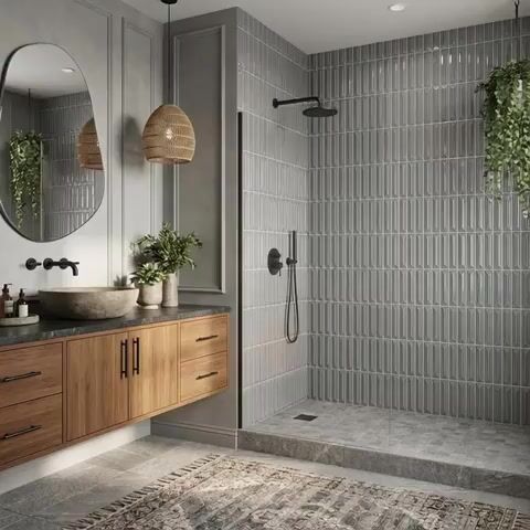 Scandinavian bathroom walkthrough with grey geometric wall tiles, natural wood vanity, and stone countertop