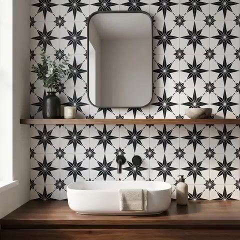 Modern bathroom walkthrough with black-and-white geometric patterned wall tiles and walnut wood vanity