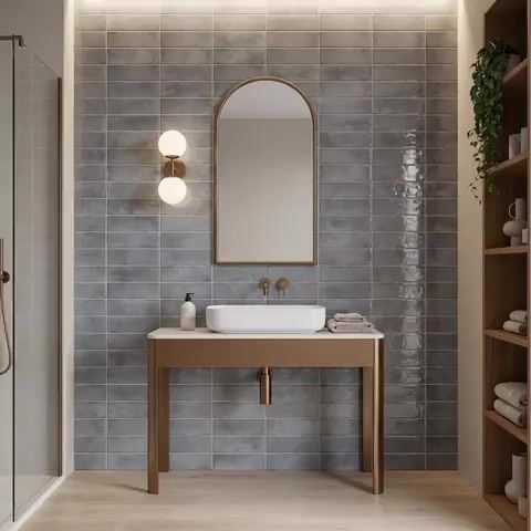 Minimalist bathroom walkthrough with grey subway wall tiles and light wood floor tile