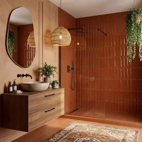 Modern bathroom walkthrough with terracotta kitkat wall tiles, matte terracotta floor tiles, and walnut wood floating vanity